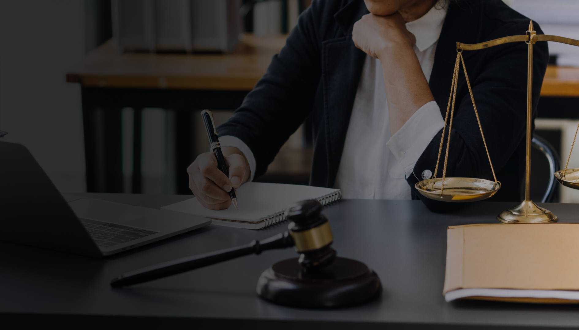 Lawyer holding a gavel beside the scales of justice