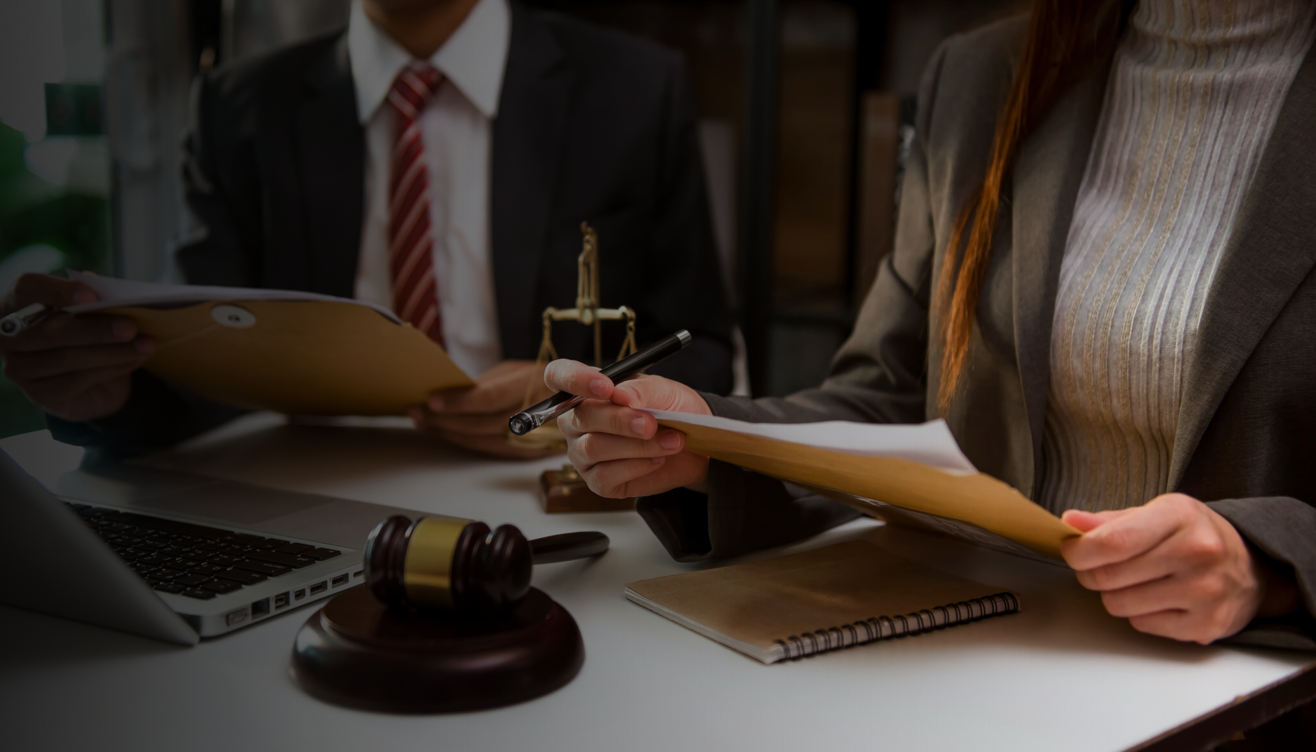 Lawyer reviewing a contract at a desk